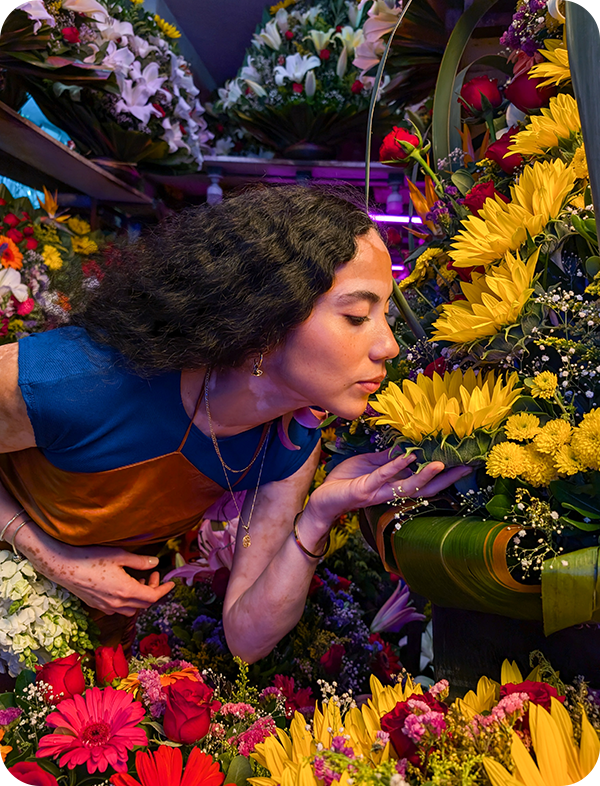 Woman smelling a flower